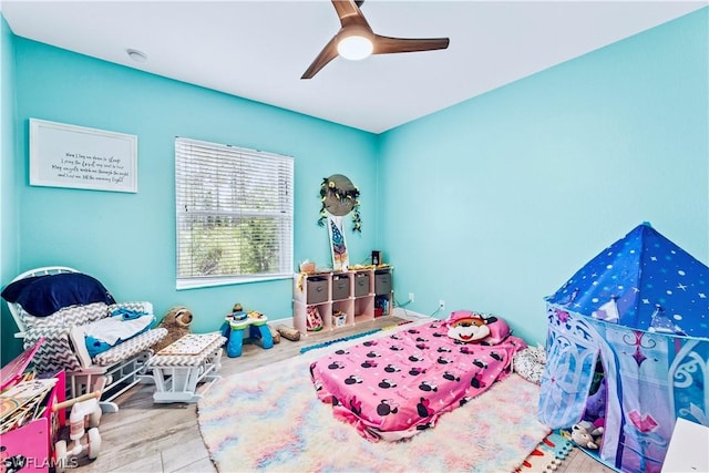 bedroom featuring hardwood / wood-style flooring and ceiling fan