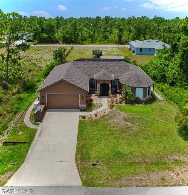 ranch-style home featuring a garage