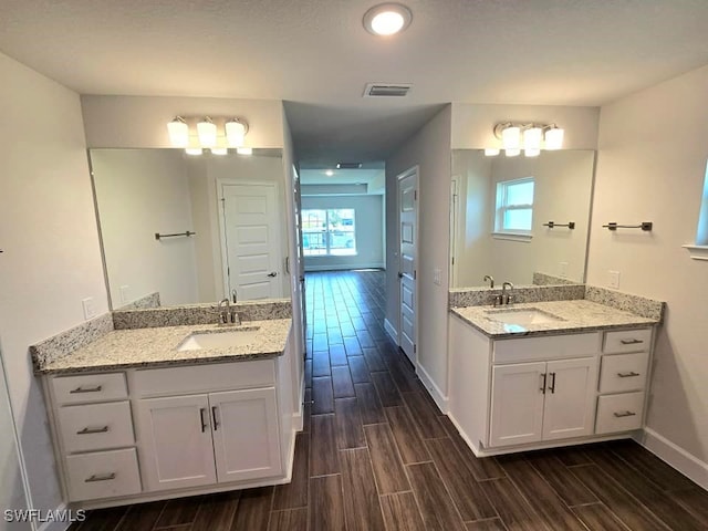 bathroom featuring vanity and wood-type flooring