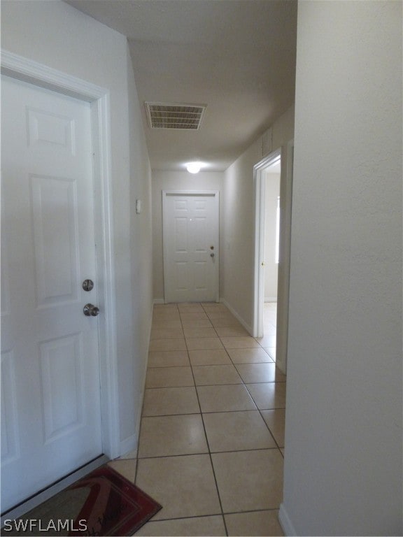 hallway with light tile floors