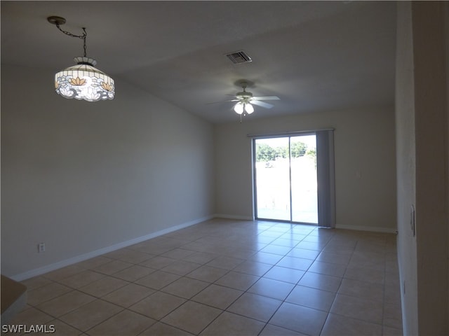 tiled spare room with ceiling fan