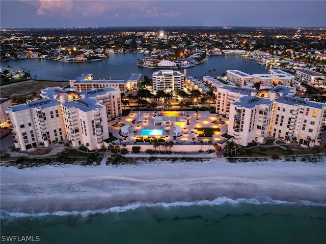 aerial view at dusk with a water view