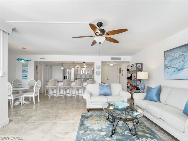 living room featuring ceiling fan