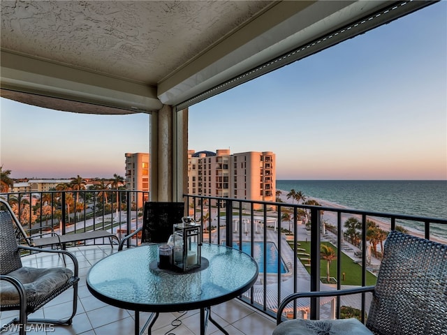 balcony at dusk with a water view