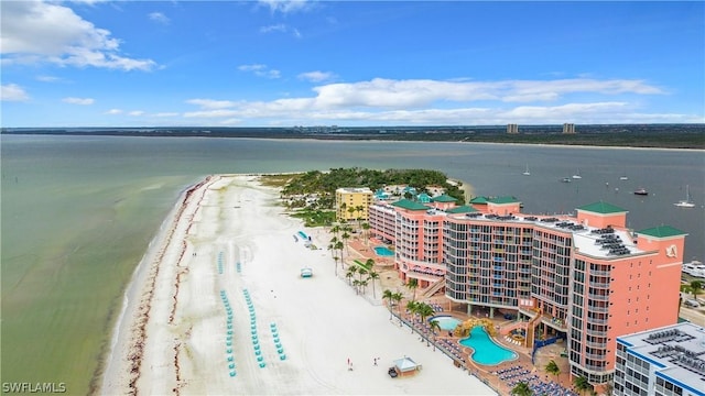 bird's eye view featuring a water view and a beach view