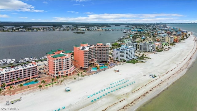 drone / aerial view with a water view and a view of the beach