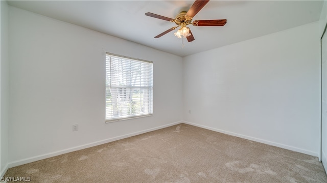 carpeted empty room with ceiling fan