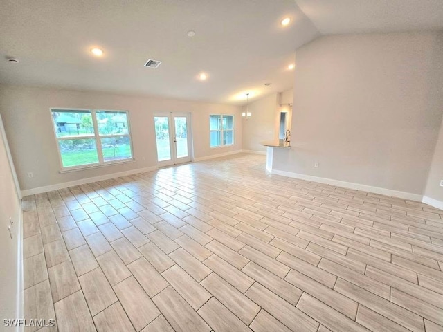 spare room with lofted ceiling