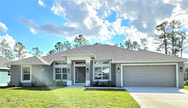 view of front of house featuring a front yard and a garage