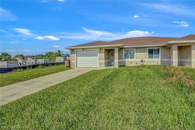 single story home featuring a garage and a front lawn