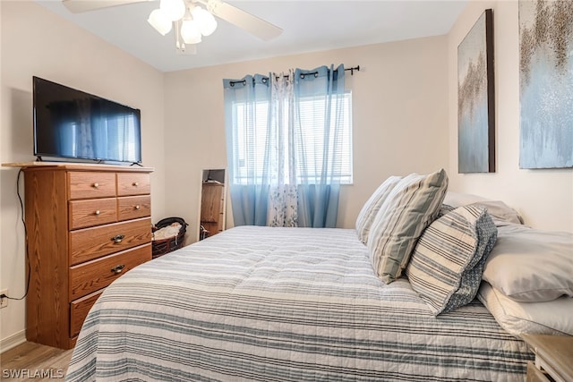 bedroom with hardwood / wood-style floors and ceiling fan