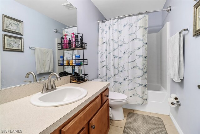 full bathroom with tile patterned flooring, vanity, toilet, and shower / bath combo with shower curtain