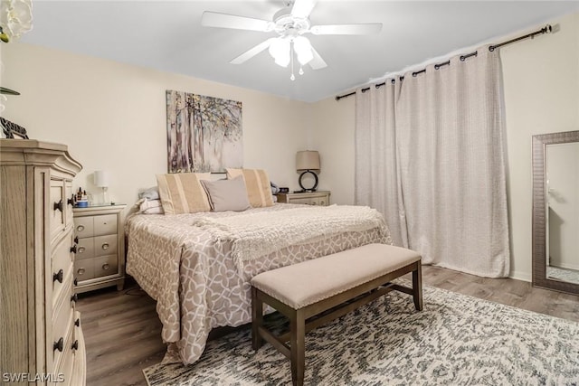 bedroom featuring ceiling fan and wood-type flooring