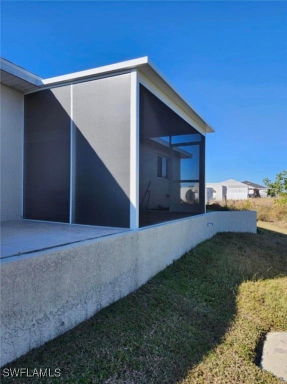 view of home's exterior featuring a yard