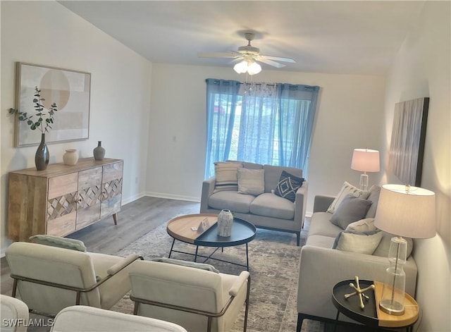 living room with hardwood / wood-style floors and ceiling fan