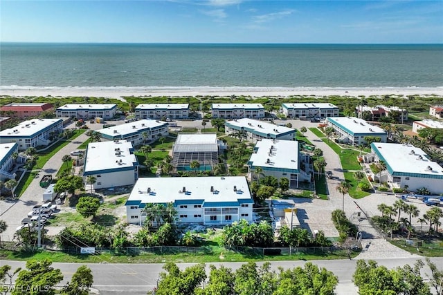 aerial view with a view of the beach and a water view