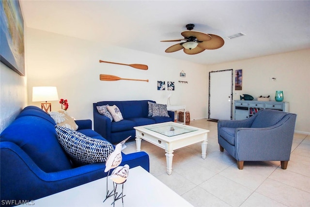 tiled living room with ceiling fan