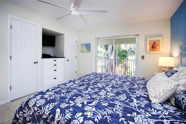 tiled bedroom featuring ceiling fan and access to outside