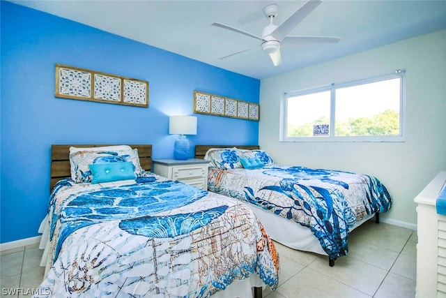 tiled bedroom with ceiling fan