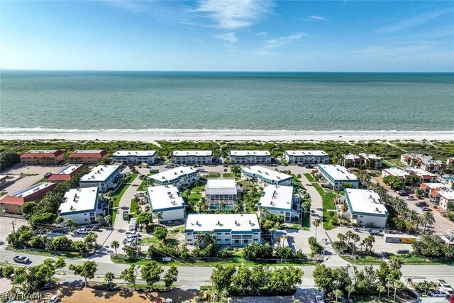 bird's eye view with a beach view and a water view