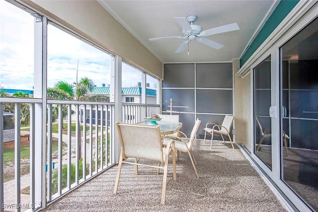 sunroom featuring a ceiling fan