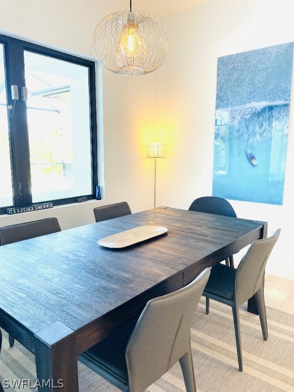 dining area featuring an inviting chandelier