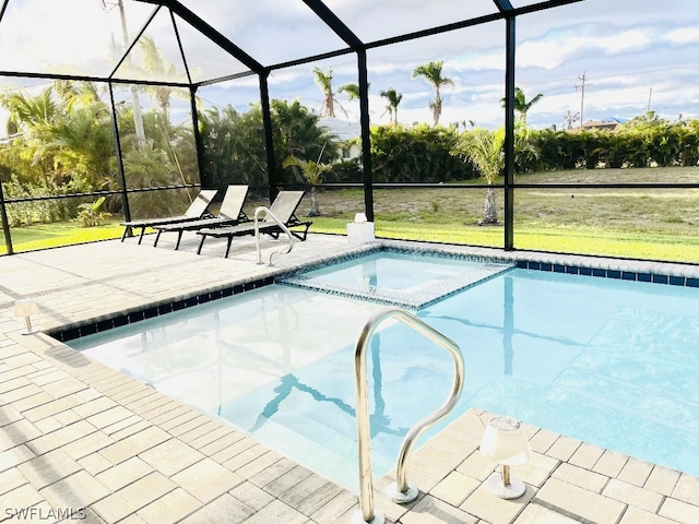 view of swimming pool featuring a patio area and glass enclosure