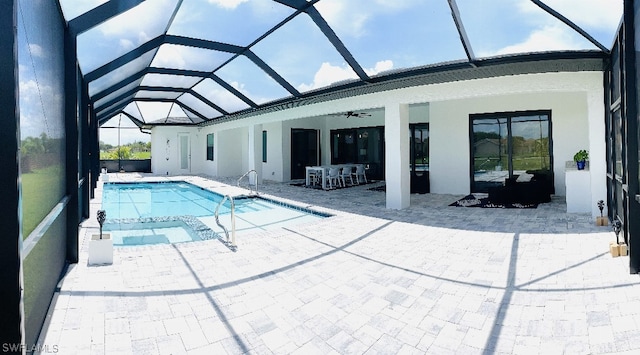 view of pool featuring a lanai, ceiling fan, and a patio