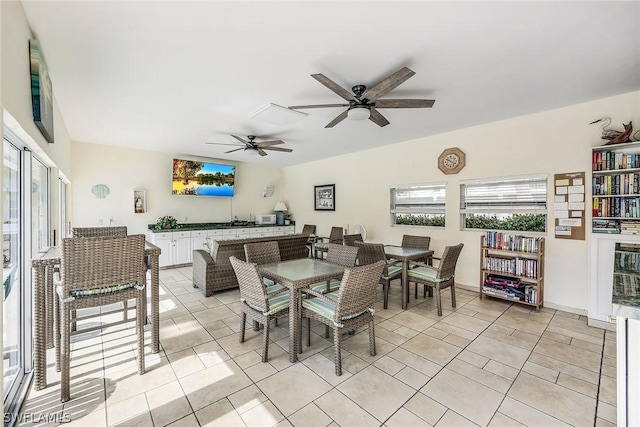 dining room featuring light tile patterned floors and a ceiling fan