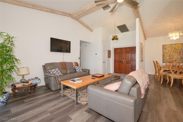 living room with beam ceiling, hardwood / wood-style flooring, and ceiling fan with notable chandelier