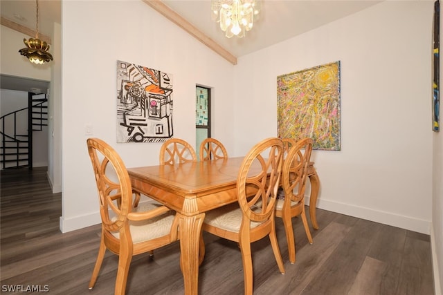 dining area featuring dark hardwood / wood-style flooring and a chandelier