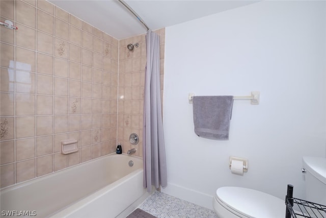 bathroom featuring shower / bath combo with shower curtain, toilet, and tile patterned flooring