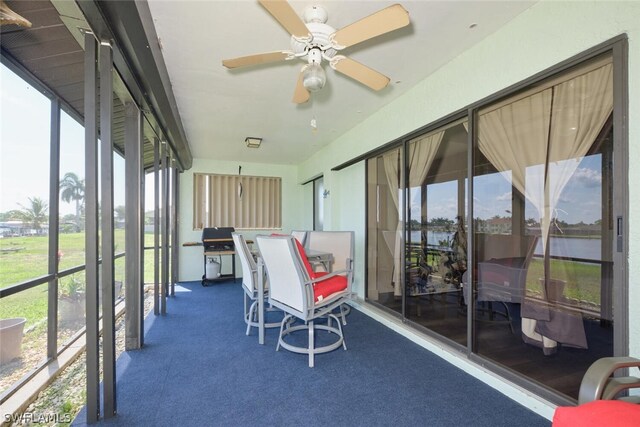 sunroom / solarium with ceiling fan