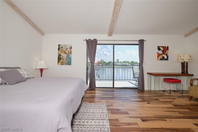 bedroom with beam ceiling, access to outside, and dark wood-type flooring