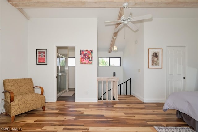 bedroom with beamed ceiling, ceiling fan, and wood-type flooring