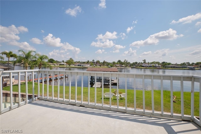 balcony featuring a dock and a water view