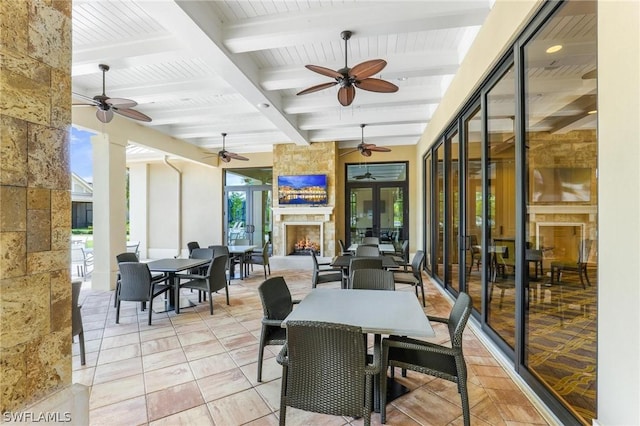 view of patio with a large fireplace and french doors