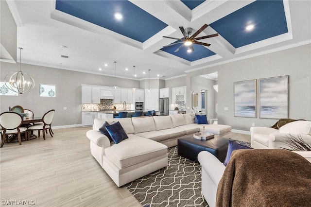 living room featuring sink, coffered ceiling, beamed ceiling, ceiling fan with notable chandelier, and ornamental molding