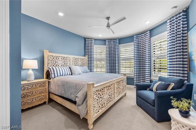 bedroom featuring ceiling fan and light colored carpet