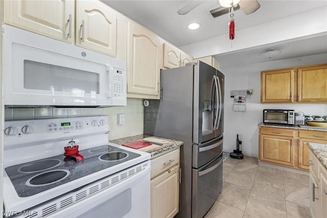 kitchen featuring light stone counters, light tile flooring, backsplash, ceiling fan, and white appliances