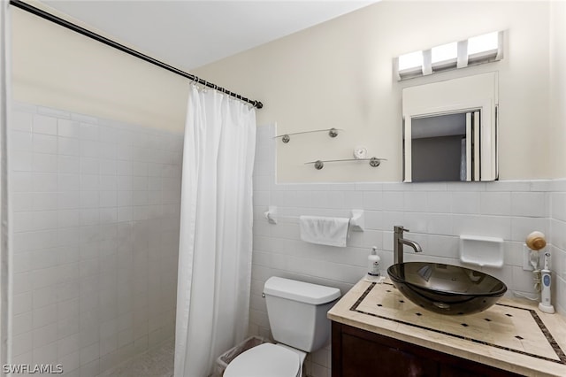 bathroom featuring tile walls, backsplash, toilet, and vanity