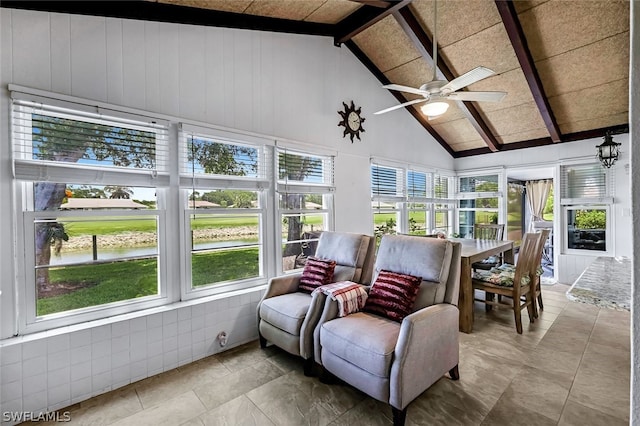 sunroom / solarium with lofted ceiling with beams and ceiling fan