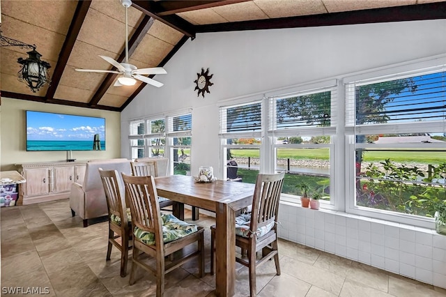 dining room with ceiling fan, beam ceiling, high vaulted ceiling, and light tile floors