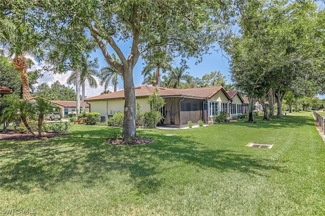 view of yard featuring a sunroom