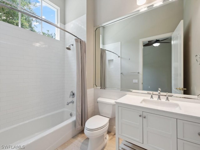 full bathroom featuring shower / bath combo, vanity, ceiling fan, tile patterned flooring, and toilet