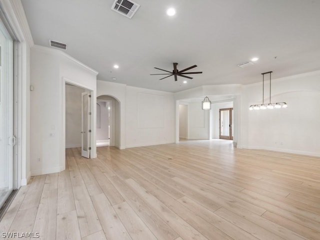 unfurnished room featuring ceiling fan, light hardwood / wood-style flooring, and crown molding