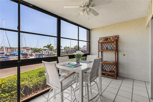 sunroom featuring ceiling fan