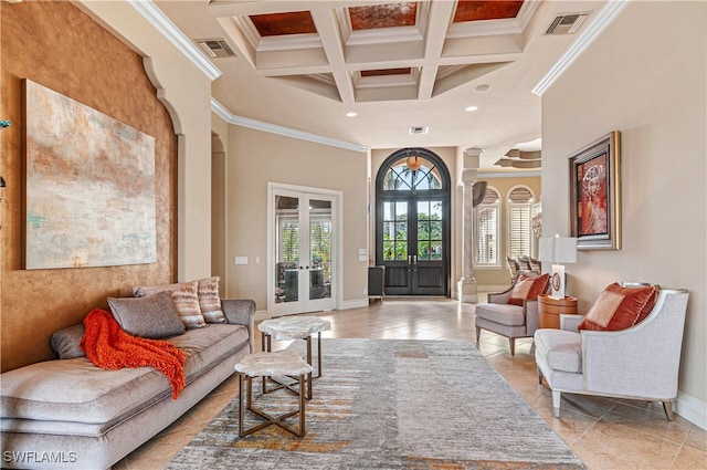 tiled living room featuring french doors, a high ceiling, coffered ceiling, beamed ceiling, and ornamental molding