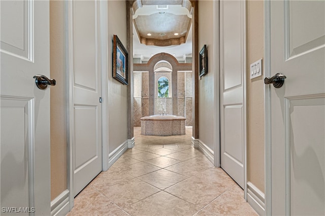 corridor featuring light tile patterned flooring