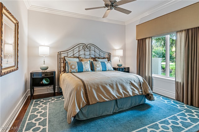 bedroom with dark hardwood / wood-style flooring, ceiling fan, and crown molding